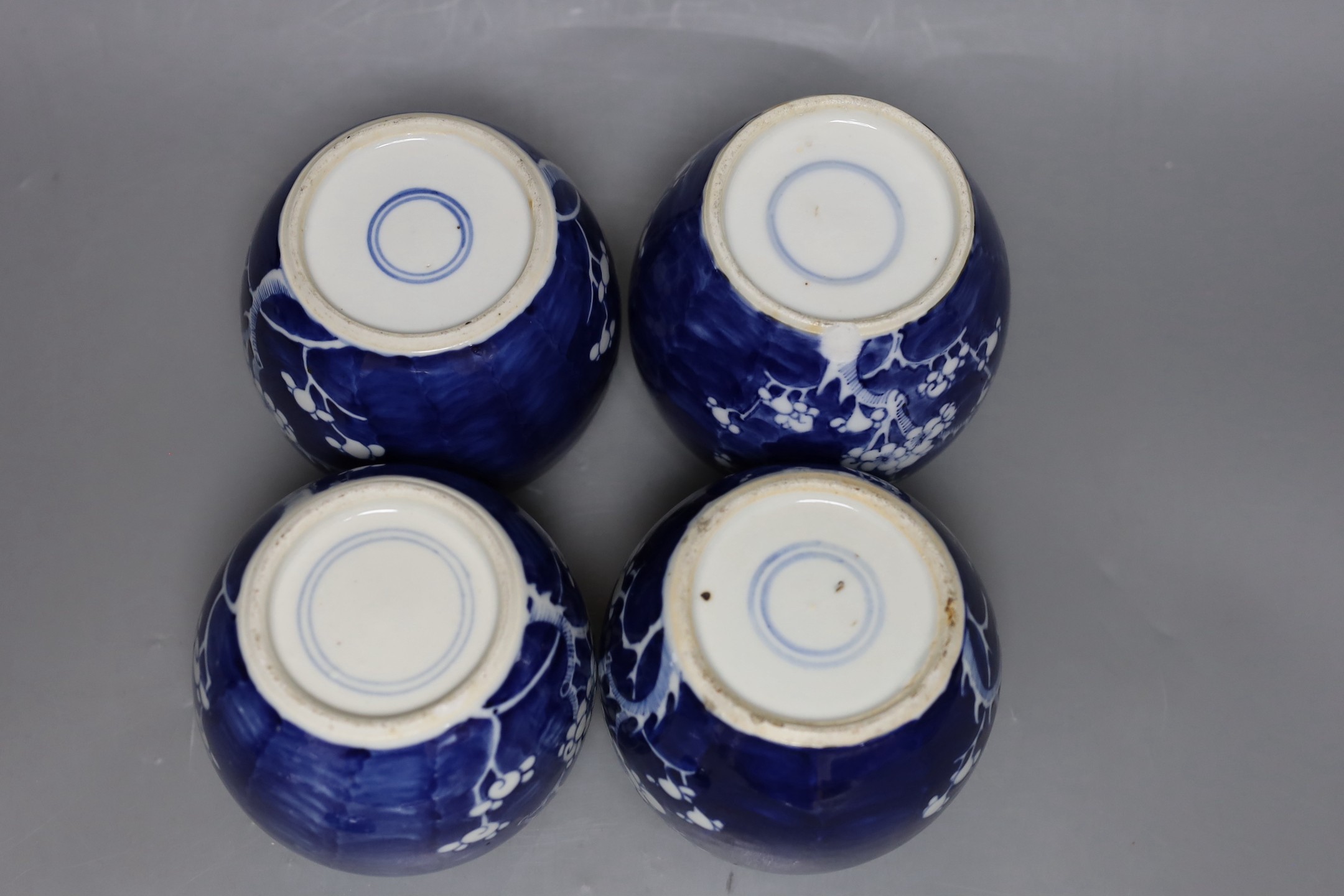 Four 19th / early 20th century Chinese blue and white prunus jars, 14cm